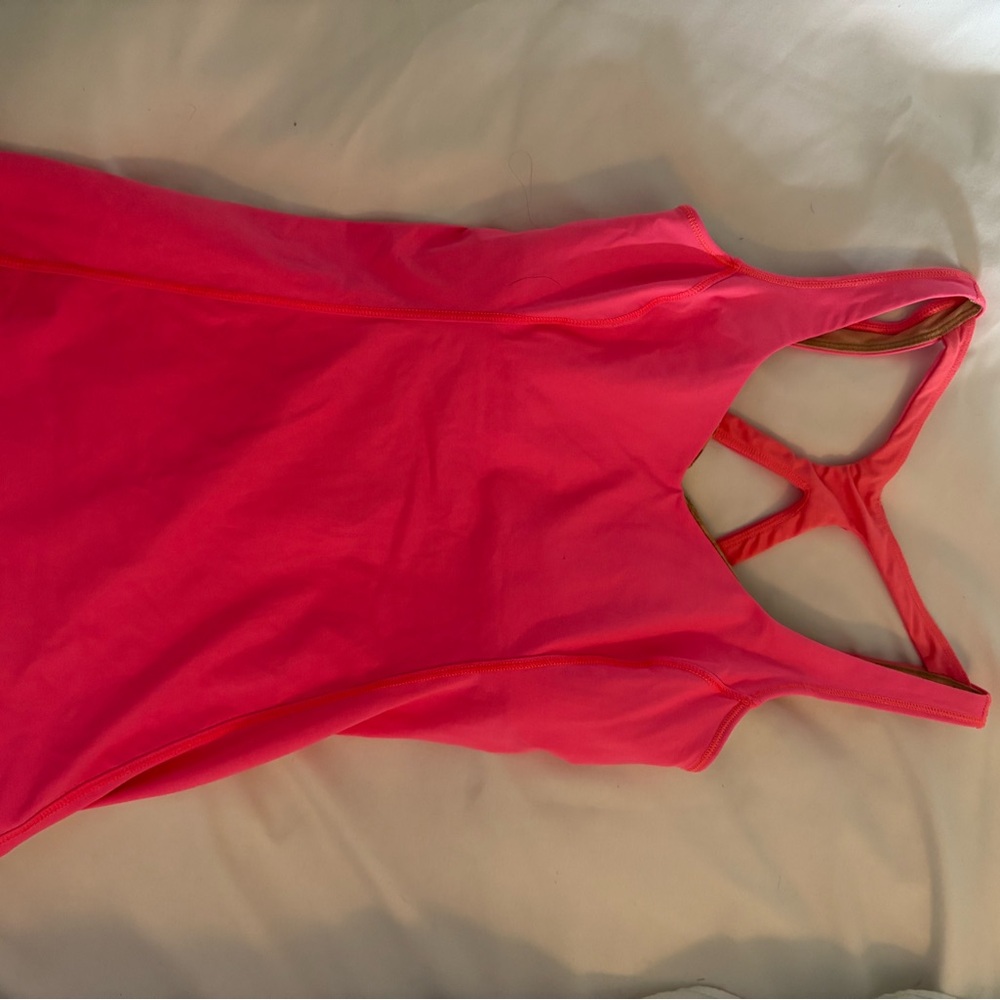 Pink Sports Bra with Intricate Back Design and Soft Stretchy Fabric